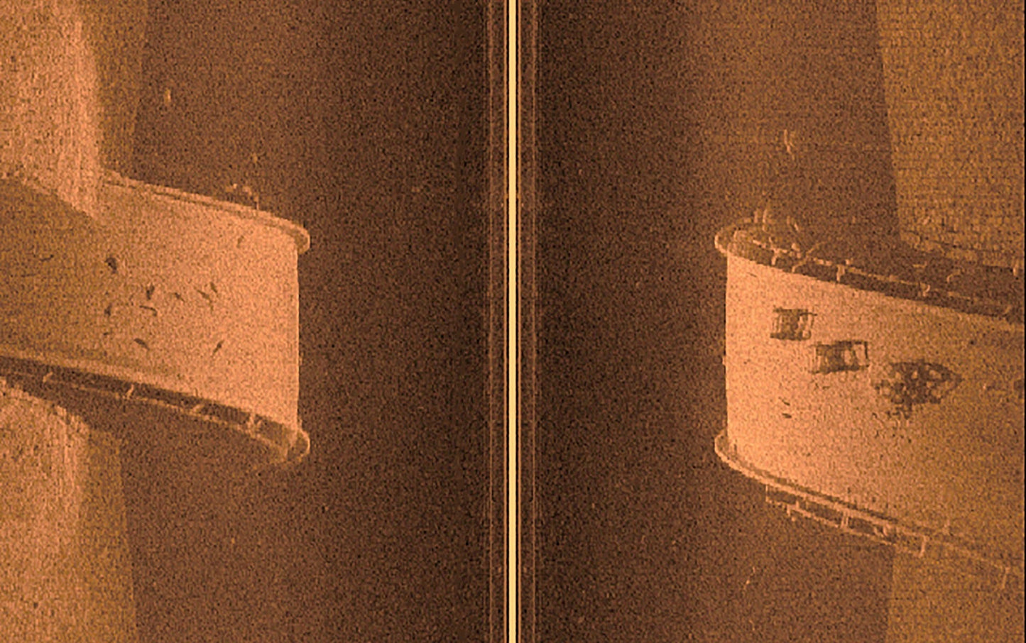 Garmin Ultra HD Scanning Sonar System components; two orange-toned cylindrical units.