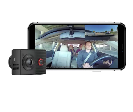 Garmin Dash Cam Tandem dual dash camera system; black compact unit beside smartphone display showing cabin and road footage